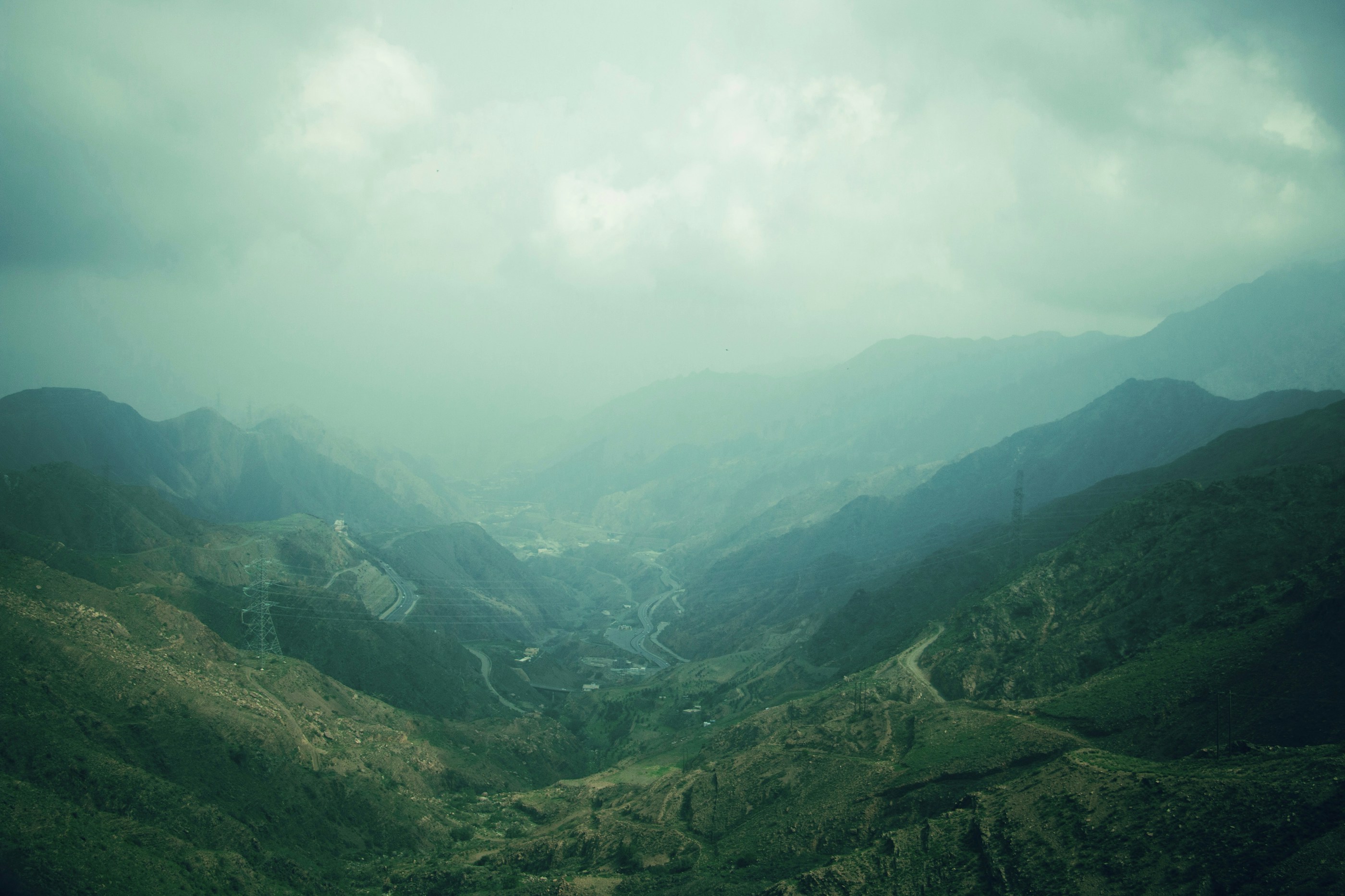 A green valley below Abha under low cloud